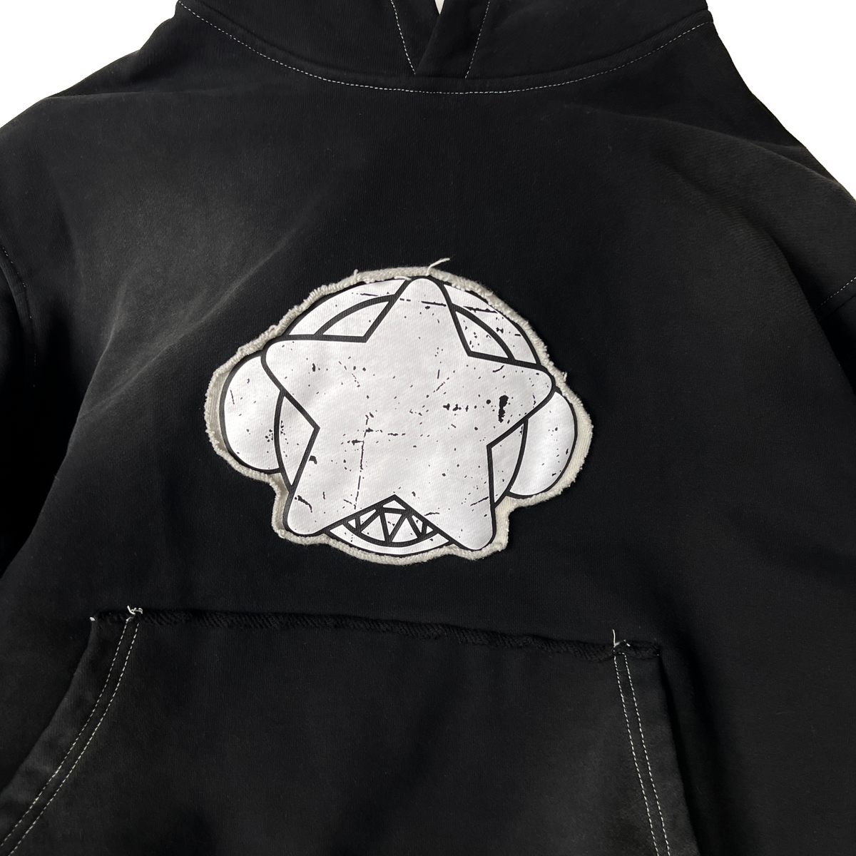 Screen-printed patch sewn onto hoodie
