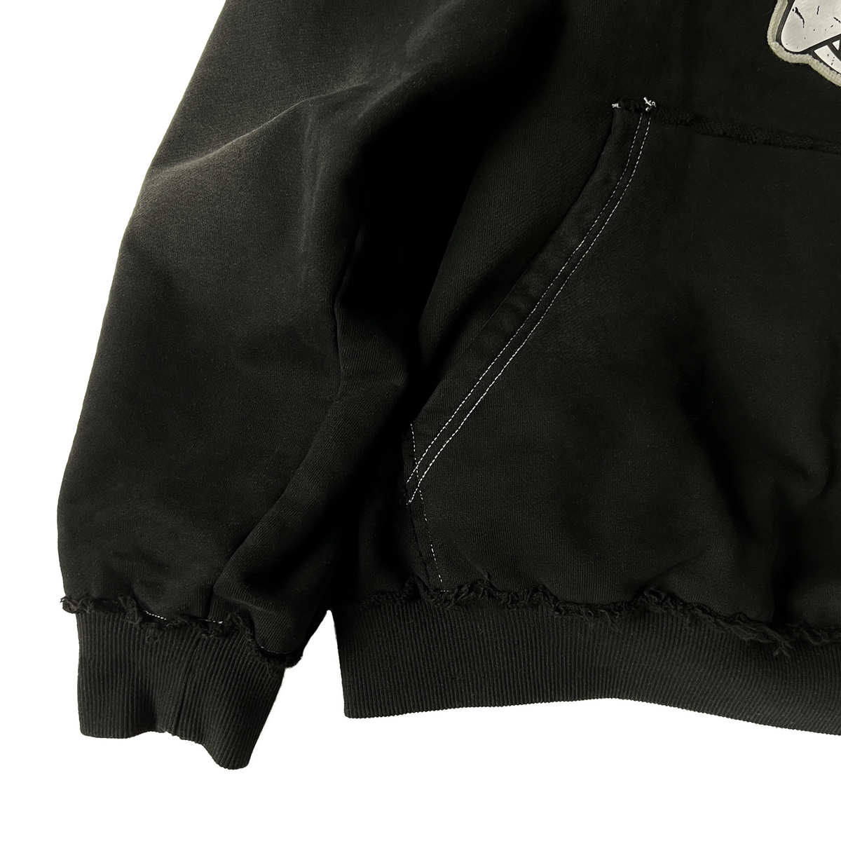 Distressed edges and contrasted white stitching